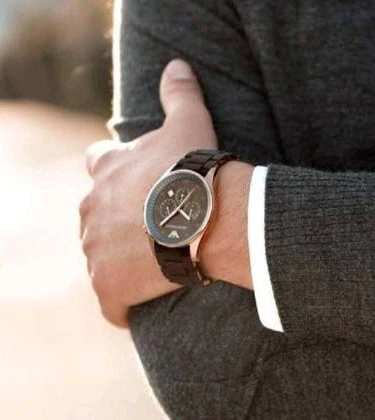 High-quality men's stainless steel watch with textured strap.