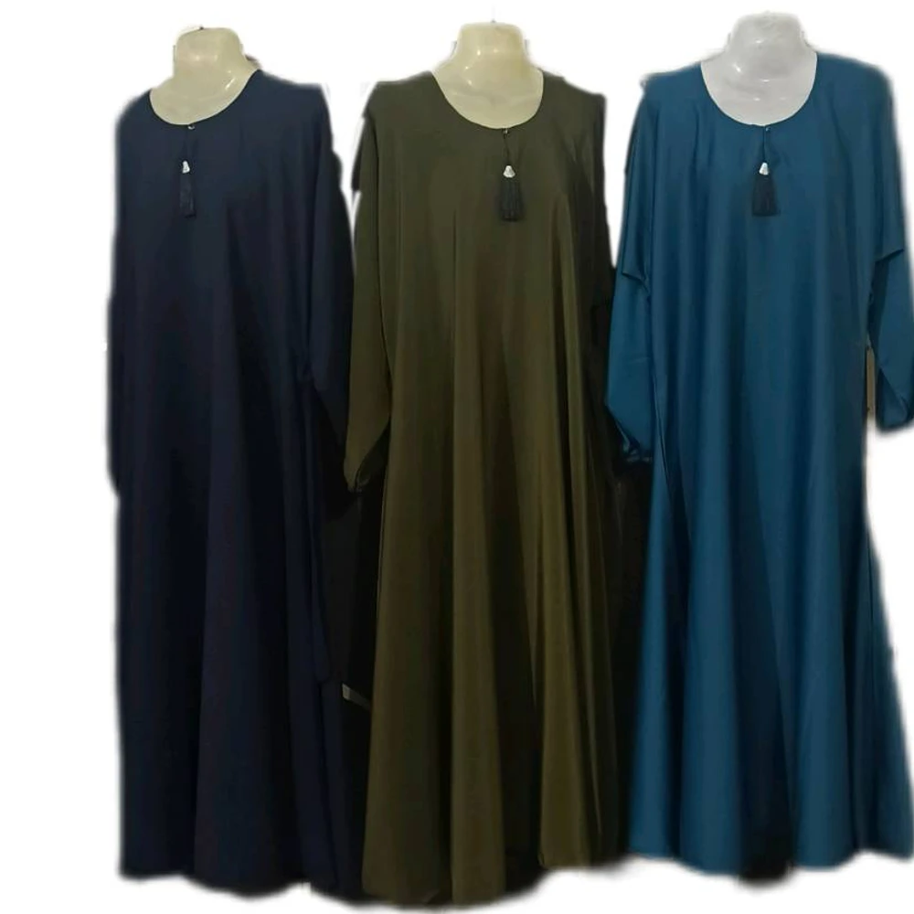 `High-quality imported plain black abaya from Hadia B. Store, hanging elegantly on a mannequin.