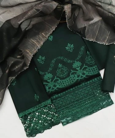 Elegant woman wearing a vibrant Chicken Kari 3-piece lawn suit, showcasing intricate Chikankari embroidery.