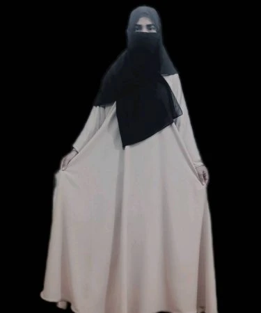 `High-quality imported plain black abaya from Hadia B. Store, hanging elegantly on a mannequin.