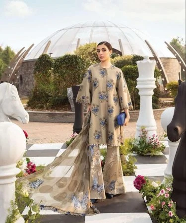 Beautiful woman wearing a vibrant 3-piece lawn summer suit.