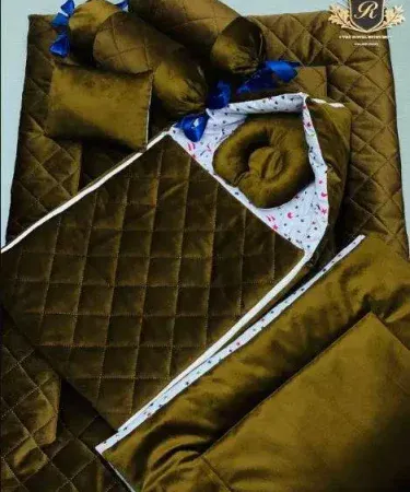 `Newborn Baby 7-Piece Velvet Set in soft blue - showcasing the wrapper, quilt, and pillows