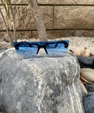 Gabbana Sunset Glow Reflectors polarized sunglasses shining brightly with a warm reflective lens effect, reducing glare and offering a stylish look.