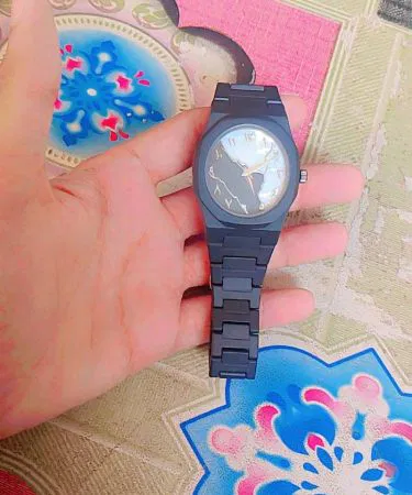 Aura watch black and white combo lightweight fiber watch for men and women with open package on doorstep for check on delivery