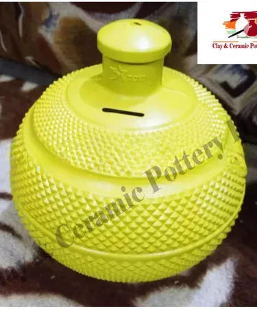 Colorful plastic money bank for kids, a gullak saving box, ideal for teaching children saving habits, available at Khareedo/Kharedo Pakistan.