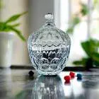 ** Elegant crystal glass sugar pot with an airtight lid, showcasing its clear, high-quality glass and wide mouth, filled with colorful candies or nuts.