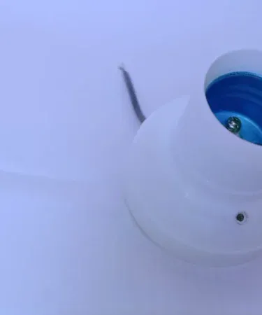 Compact Type-C Mini USB Smartphone Fan plugged into an Android phone, providing a refreshing breeze, highlighting its portability and functionality.