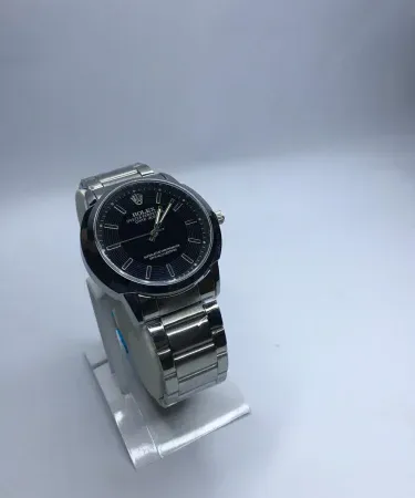 Sleek stainless steel men's watch with a black dial and chronograph features, displayed on a wooden surface, highlighting quality and style for the Pakistani market. Available at Khareedo|Kharedo with Check on Delivery.