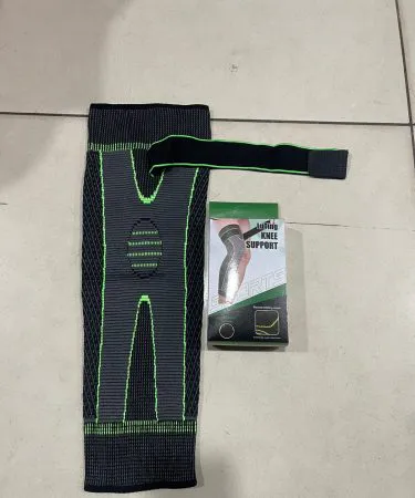 Adult wearing black anti-slip knee pads for sports, showcasing flexibility and robust knee joint support.