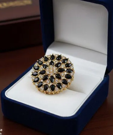 Golden plated Tear Flower adjustable ring for women, featuring a sparkling synthetic stone, displayed elegantly on a hand.