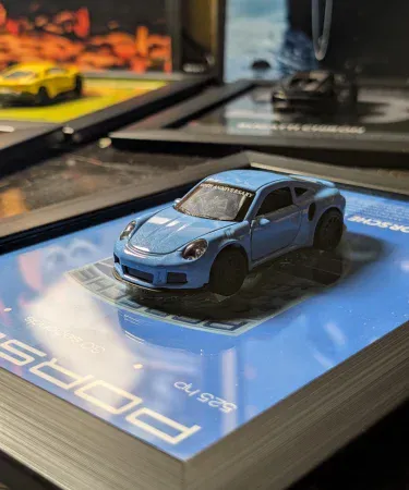 Porsche 911 GT3 3D Car Frame featuring a red diecast metal 1:43 scale model with opening doors, mounted inside a premium black frame, displayed as stylish wall art for a boy's room or car enthusiast.