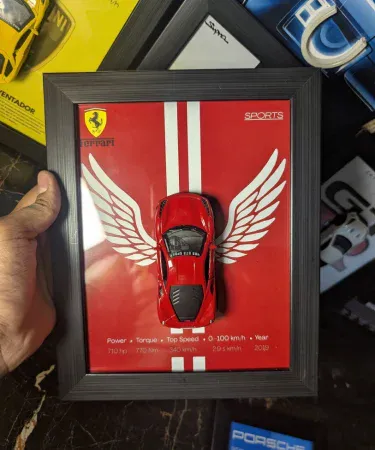 Close-up of a red Ferrari F8 3D Diecast Metal Car Frame by ARTZAY, showcasing the 1:43 scale model and premium 10.5x8.5 inch black frame, ideal for stylish wall decor in a boys' room or car enthusiast's space, available on Khareedo Pakistan with check on delivery service.