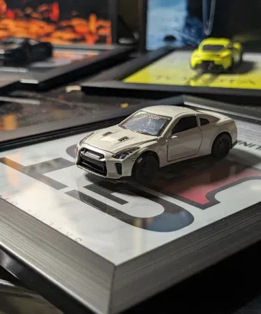 Nissan GTR R35 3D Diecast Metal Car Frame wall art for boys room, featuring a 1:43 scale model with opening doors in a premium 10.5x8.5 inch frame.