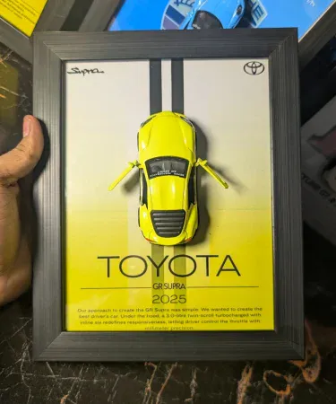 Supra Mk5 3D Diecast Car Frame with opening doors, a premium metal wall decor and car poster for boys and car lovers, displayed on a wall.