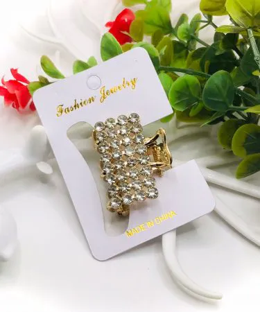 A variety of trendy hair clips including claw clips, barrettes, and snap clips in different colors and styles, displayed elegantly on a pastel background, suitable for women and girls.