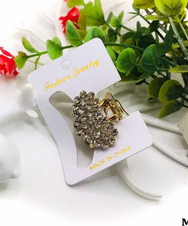 A variety of trendy hair clips including claw clips, barrettes, and snap clips in different colors and styles, displayed elegantly on a pastel background, suitable for women and girls.