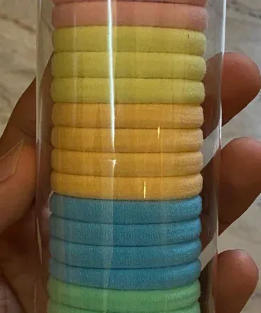 Vibrant pack of multicolor hair ponies and elastic hair bands for girls, perfect for stylish kids' ponytails and braids. Available on Khareedo/Kharedo for online purchase.