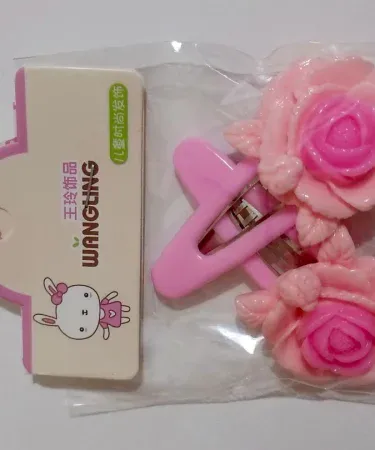 Vibrant multi-coloured rose hair pins for girls, showcasing various delicate floral designs and bright hues.