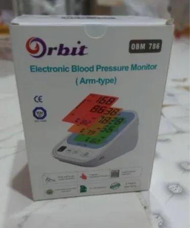 Orbit OBM-786 Electronic Arm Blood Pressure Monitor with digital display showing blood pressure readings, suitable for home health monitoring.