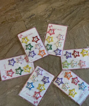 Multicolored star shaped hair pins for girls, vibrant hair accessories pack, Khareedo product image.