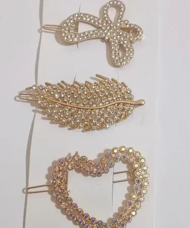 Close-up of elegant Golden Coloured Beautiful hair pins for girls, showcasing a radiant metallic finish and secure design, ideal for various hairstyles and available on Khareedo/Kharedo Pakistan.