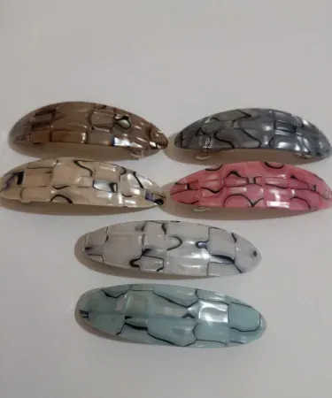 A collection of vibrant and beautiful hair clips for girls, featuring various styles, colors, and designs suitable for different hairstyles and occasions.