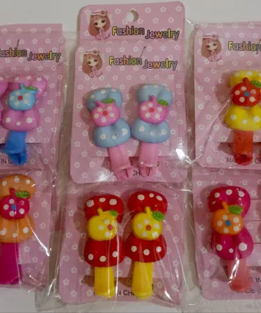 A vibrant collection of multi colored hair pins for girls, featuring various styles and bright hues, perfect as cheerful hair accessories for children.