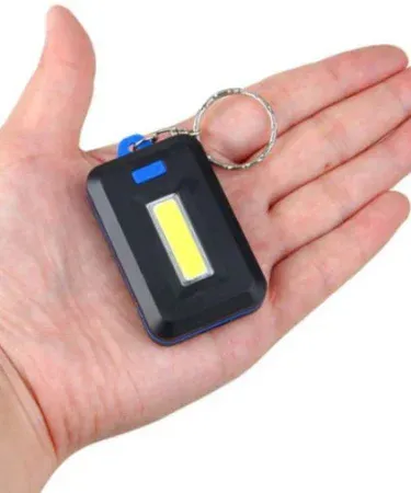 Sleek black portable mini LED light keychain torch (Model LKCA19) for car interior and everyday use, available on Khareedo/Kharedo.