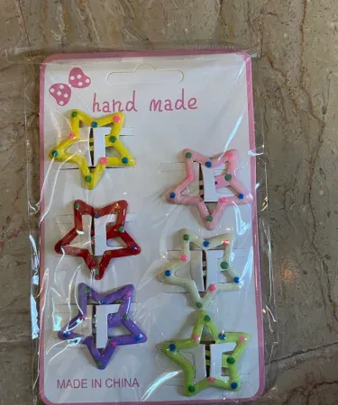 Multicolored star shaped hair pins for girls, vibrant hair accessories pack, Khareedo product image.