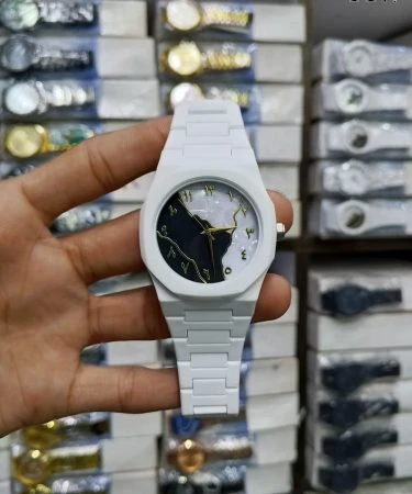 AURA WHITE WATCH with MARBLE DIAL, a sleek and elegant ladies' timepiece made from lightweight fiber material, featuring a secure butterfly lock. The watch face showcases a unique marble pattern, set against a clean backdrop, perfect for modern women seeking comfort and style.