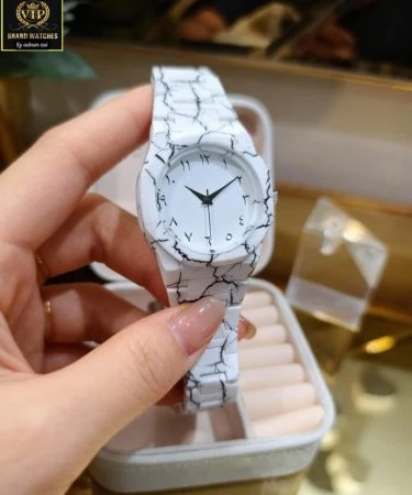 WHITE TIGER AURA ARABIC WATCH with white tiger print dial, fiber chain, and Arabic numerals on a dark background.