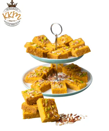 KKM Anday Ki Mesub traditional sweet squares made with gur and flour, rich desi mithai, fresh Pakistani sweet, authentic dessert.