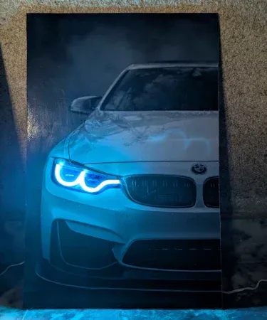 BMW Neon LED Light Poster 12x18 Inches for car lovers' room decor with vibrant blue LED glow and iconic BMW logo, perfect for garages, studios, and gamer setups bought from Khareedo and Kharedo.