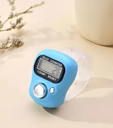 Digital Tasbih Finger Counter displaying different colors, ergonomic design for Zikr and prayer tally.