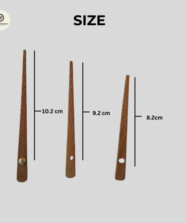 Close-up view of elegant wooden clock hands and needles, showcasing their natural wood grain and craftsmanship.