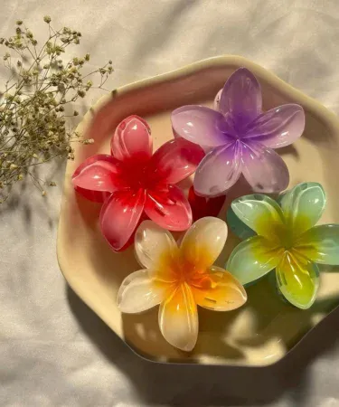 Pack of 2 large Hawaiian Plumeria flower hair claws with strong non-slip grip, ideal for summer beach headwear for women and girls with thick or thin hair