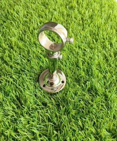 Two uniquely designed stainless steel curtain rod brackets in a gleaming chrome finish, perfect for modern home decor and window treatments.