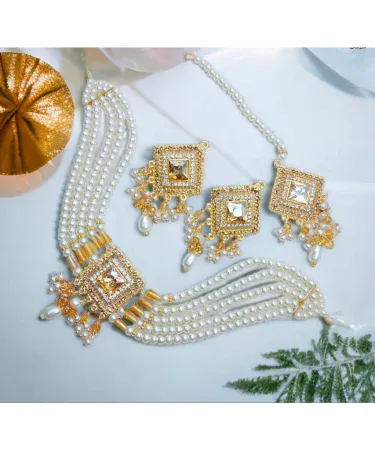 New fancy pearl choker patti set with matching earrings and tika for girls and women, latest Pakistani design with elegant pearls, perfect for weddings and festive occasions, available on Khareedo.