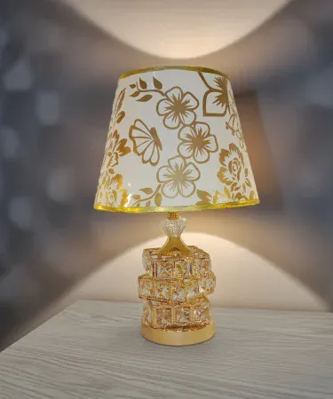 Elegant 18‑inch crystal table lamp with LED shade for bedroom and living room, placed on a modern side table