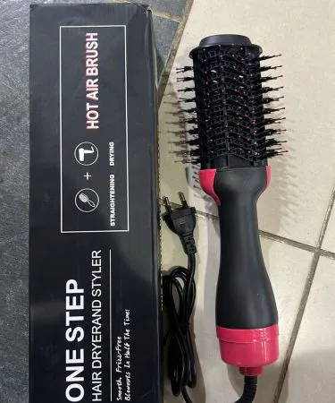 3‑in‑1 One Step Hot Air Brush Hair Dryer & Styler showing sleek design and brush head, imagecaption=Stylish 3‑in‑1 hot air brush for drying, straightening and volumizing – available on Khareedo | Kharedo.