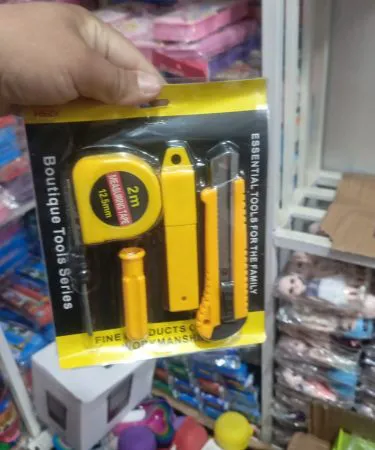 5-piece screwdriver tape measure art knife combination set laid out on a wooden workbench, imagecaption=Premium 5-piece screwdriver, tape measure & art knife set – shop now on Khareedo & Kharedo with Check on Delivery.