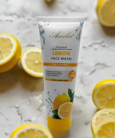 Amelia Lemon Face Wash bottle with fresh lemons and vitamin icons – brightening facial cleanser for glowing skin