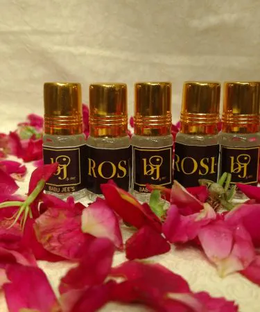 Attar’s premium natural perfume bottle with elegant packaging, showcasing rose, sandalwood, and oud scents – perfect for gifting and personal use.