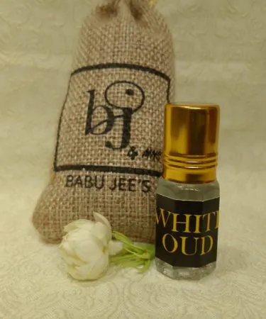 Attar’s premium natural perfume bottle with elegant packaging, showcasing rose, sandalwood, and oud scents – perfect for gifting and personal use.