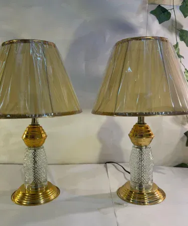Golden modern 2‑piece metal and glass table lamp set with clear shade, 18 inch height, perfect for bedside and living‑room décor, imagecaption=Elegant golden metal‑glass table lamp set – ideal for adding a stylish lighting touch to any room.