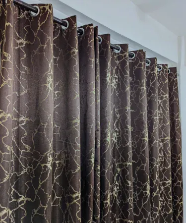 Gold textured sparkle curtains for living room and bedroom, imagecaption=Elegant gold textured curtains with subtle sparkle – perfect for enhancing any living room or bedroom décor.