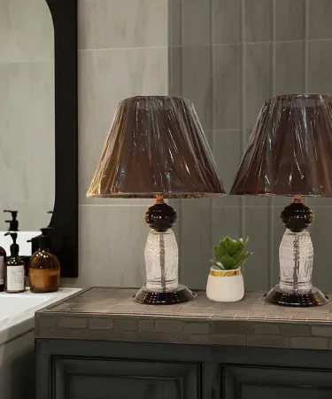 Set of two black and gold table lamps with night light feature for bedroom decoration , imagecaption=Elegant black and gold table lamps – perfect for bedroom and living room décor ,