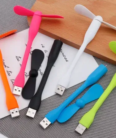 Usb Mini Portable Flexible Fan black color on desk, imagecaption=Compact USB Mini Portable Flexible Fan – perfect for home, office, or travel ,