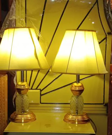 Black and gold table lamp set with sleek black fabric shade and golden glowing interior, perfect for bedroom and décor