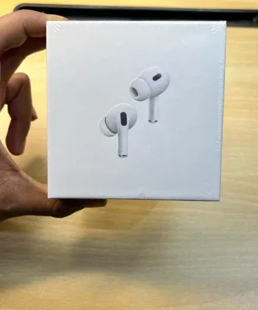 Earpods Pro 2nd Generation wireless earbuds with charging case, sleek black design, shown on a modern desk